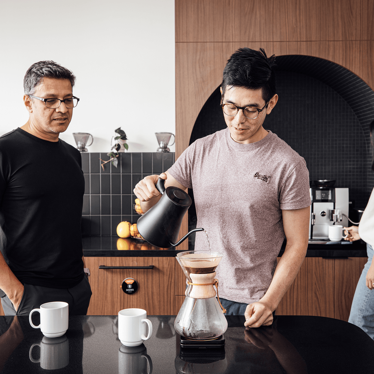 Luminary team members collaborating over coffee